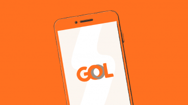 Illustration with an orange background of a smartphone with the GOL logo on the screen.